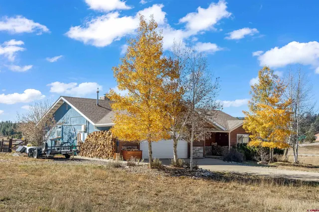 a view of a house with a snow in front of it