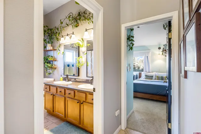 a bathroom with a tub sink and mirror