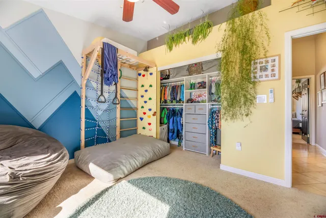 a bedroom with a bed and a walk in closet