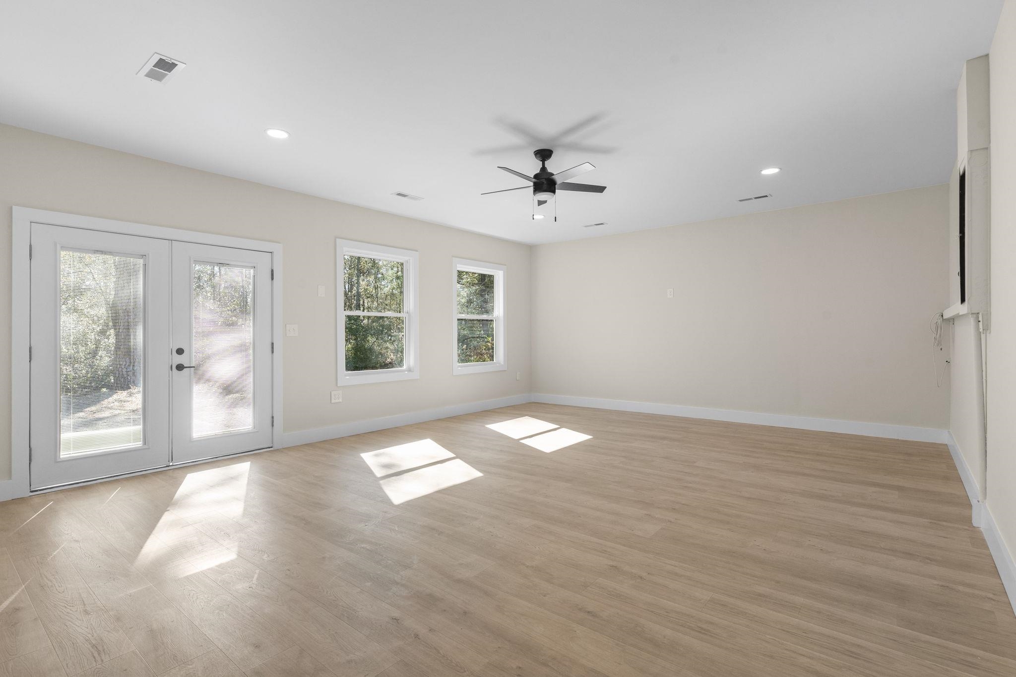 947 Fox Hollow Road Conway, SC 29526 - Photo 21 of 40 Unfurnished room featuring light wood finished floors, french doors, recessed lighting, and a ceiling fan