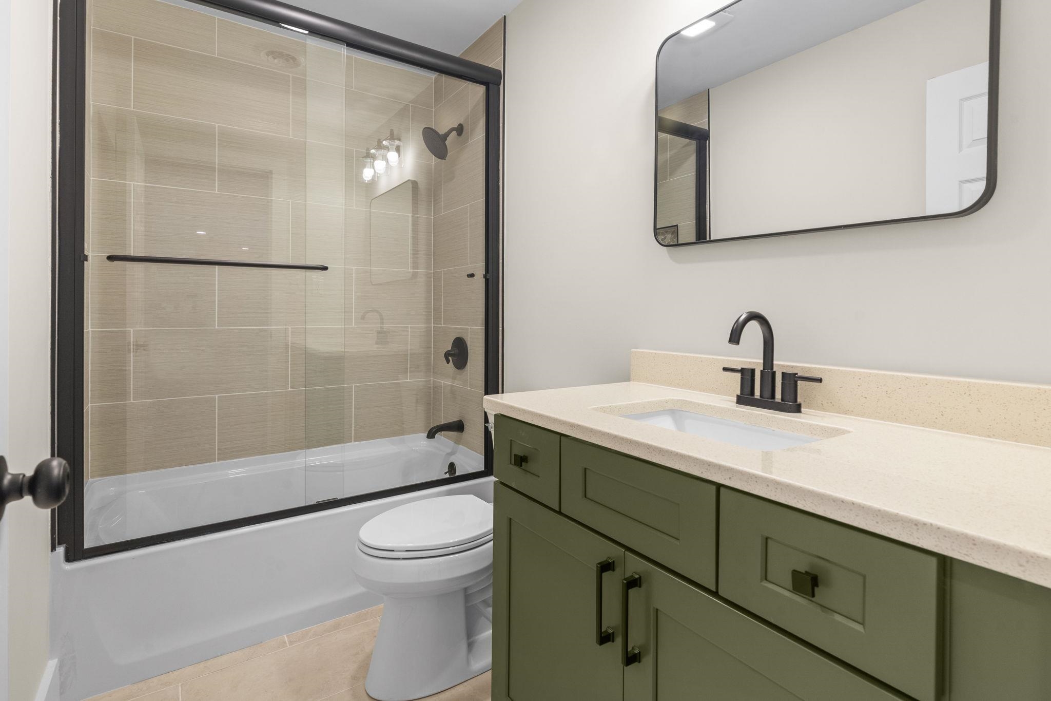 947 Fox Hollow Road Conway, SC 29526 - Photo 27 of 40 Bathroom with vanity, shower / bath combination with glass door, and light tile patterned flooring