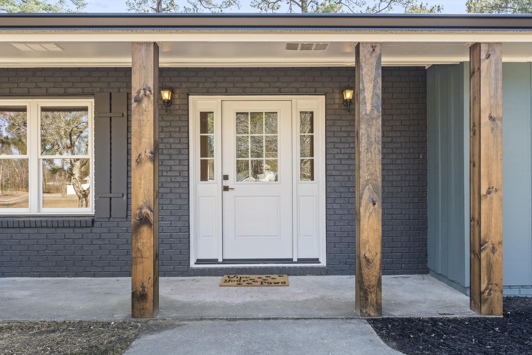 947 Fox Hollow Road Conway, SC 29526 - Photo 5 of 40 View of exterior entry with brick siding and covered porch