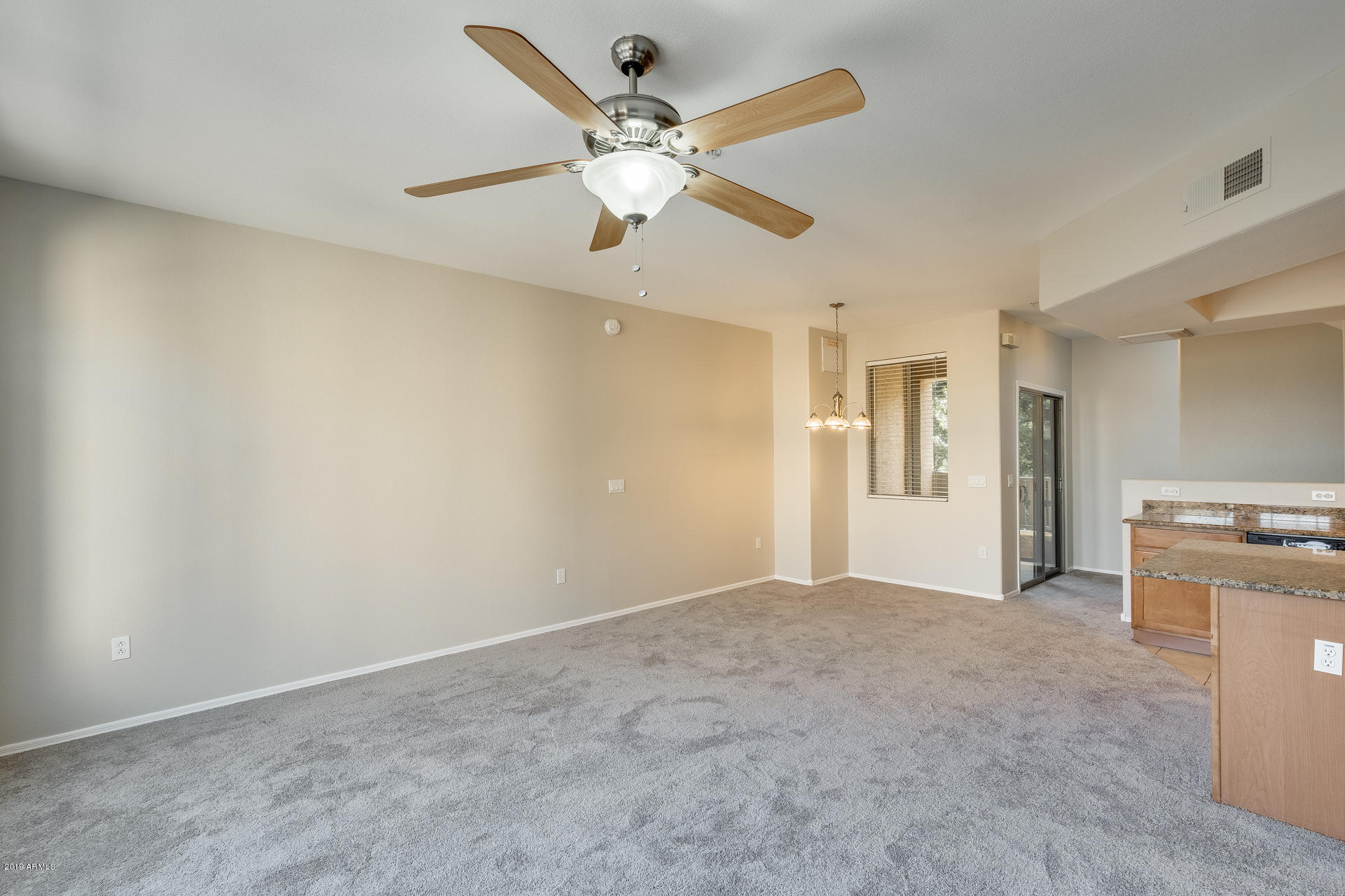 2401 East Rio Salado Parkway, Unit 1124 Tempe, AZ 85288 - Photo 15 of 32 a view of a kitchen with a sink and a ceiling fan