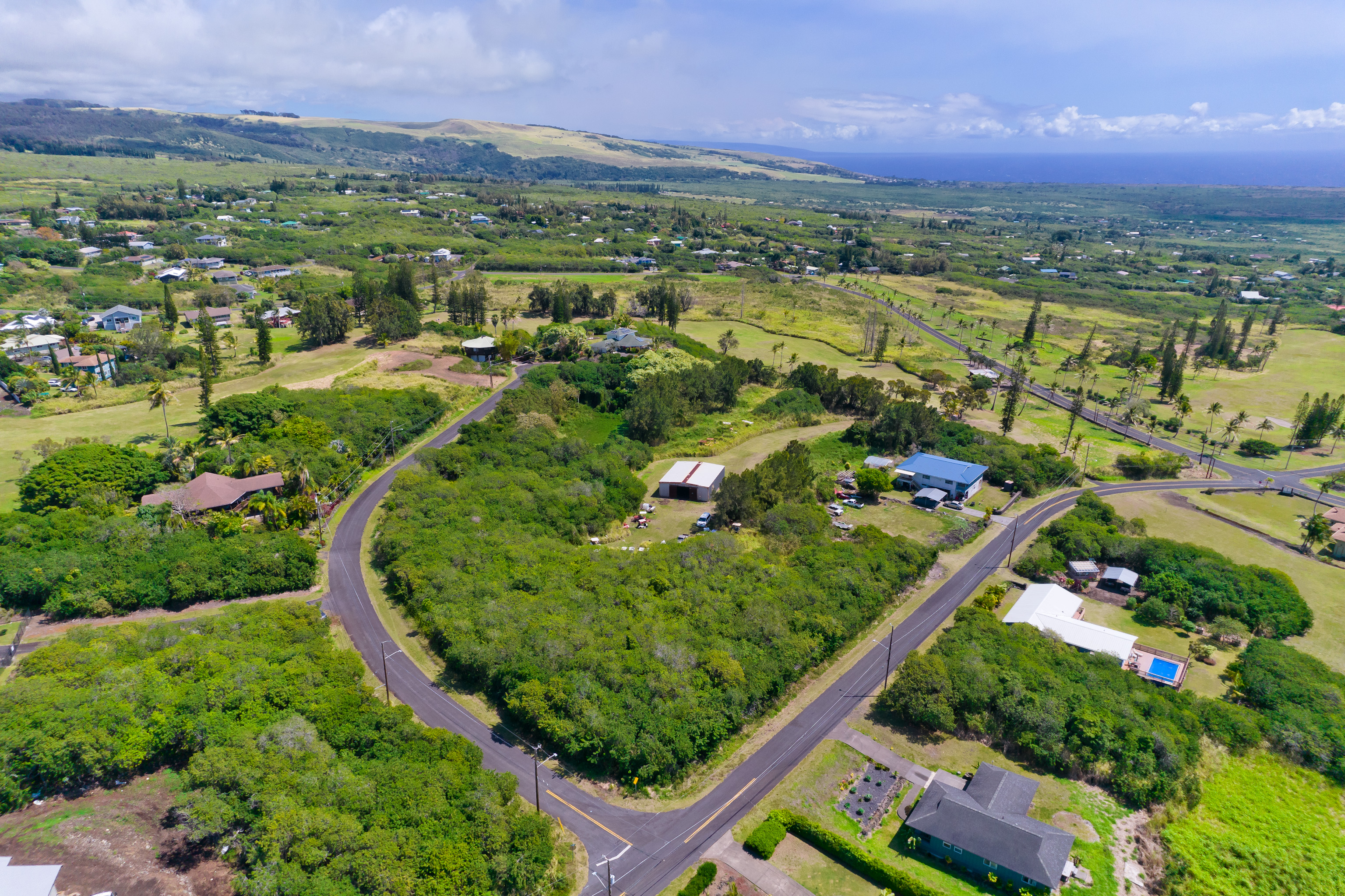 263 Kaulua Street Naalehu, HI 96772 - Photo 11 of 12 a view of a city with mountains in the background