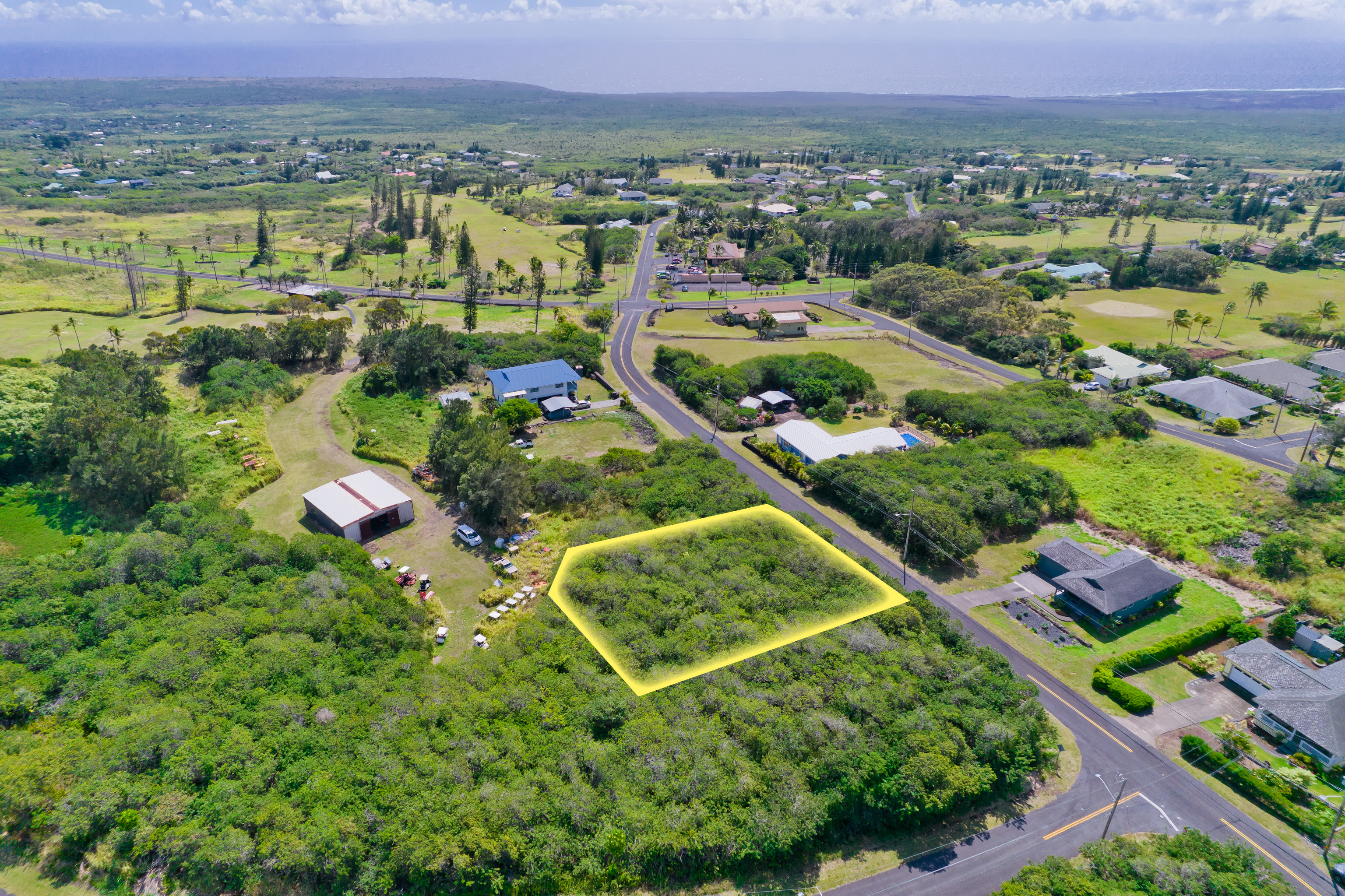 263 Kaulua Street Naalehu, HI 96772 - Photo 9 of 12 an aerial view of multiple house