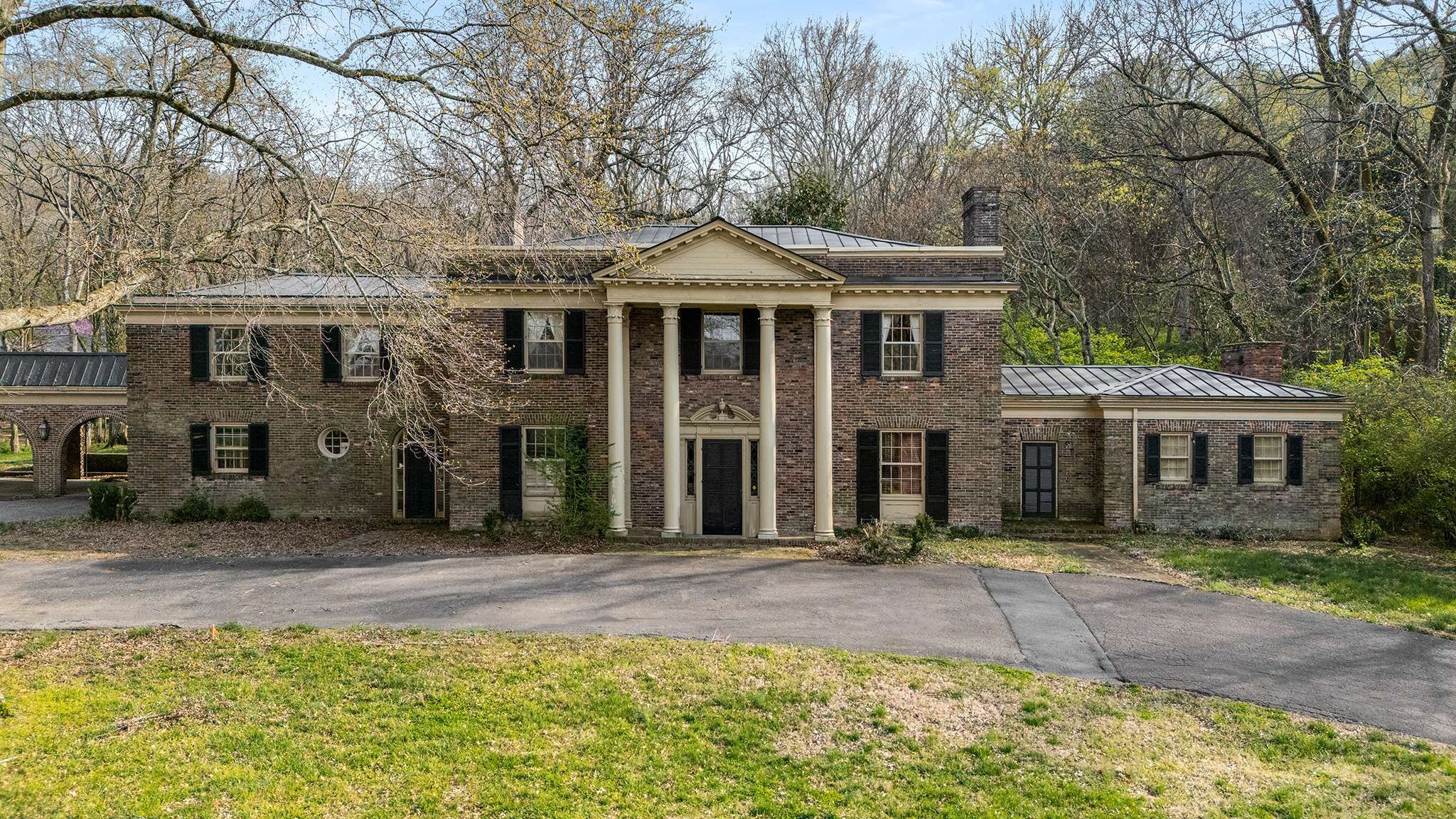 1416 Chickering Road Nashville, TN 37215 - Photo 2 of 12 a front view of a house with a garden