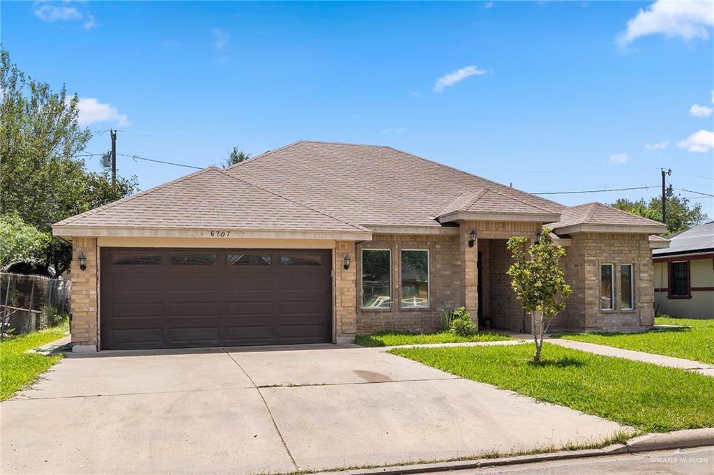 6707 South Rios Street Pharr, TX 78577 - Photo 2 of 17 a front view of house with garage