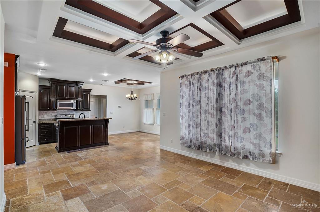 6707 South Rios Street Pharr, TX 78577 - Photo 4 of 17 a large kitchen with cabinets and stainless steel appliances