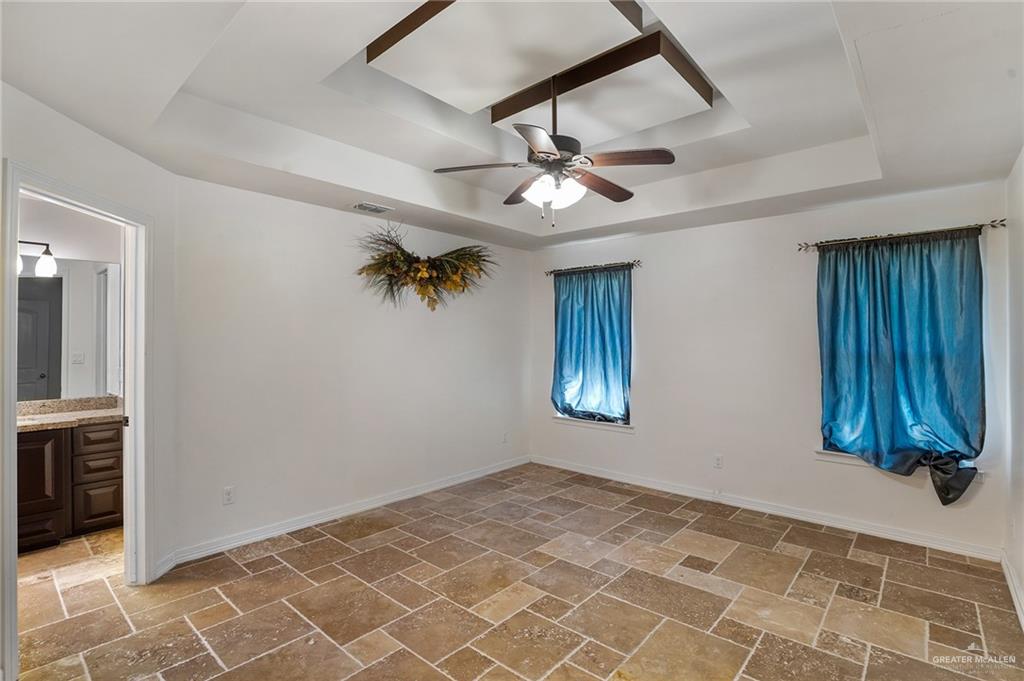 6707 South Rios Street Pharr, TX 78577 - Photo 8 of 17 an empty room with windows and fan