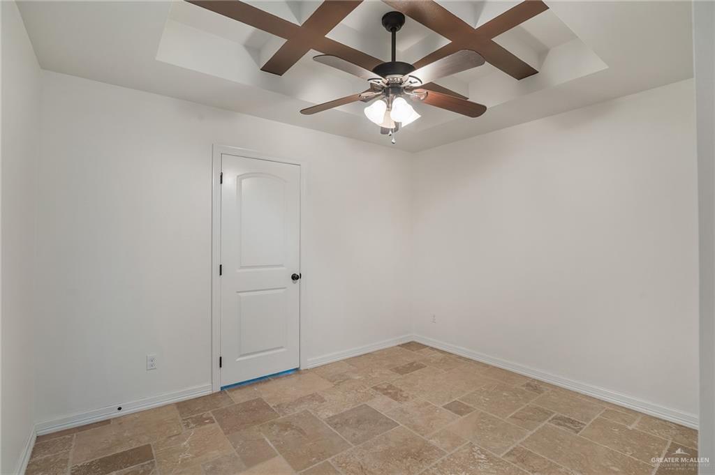 6707 South Rios Street Pharr, TX 78577 - Photo 9 of 17 an empty room with a fan and a fan