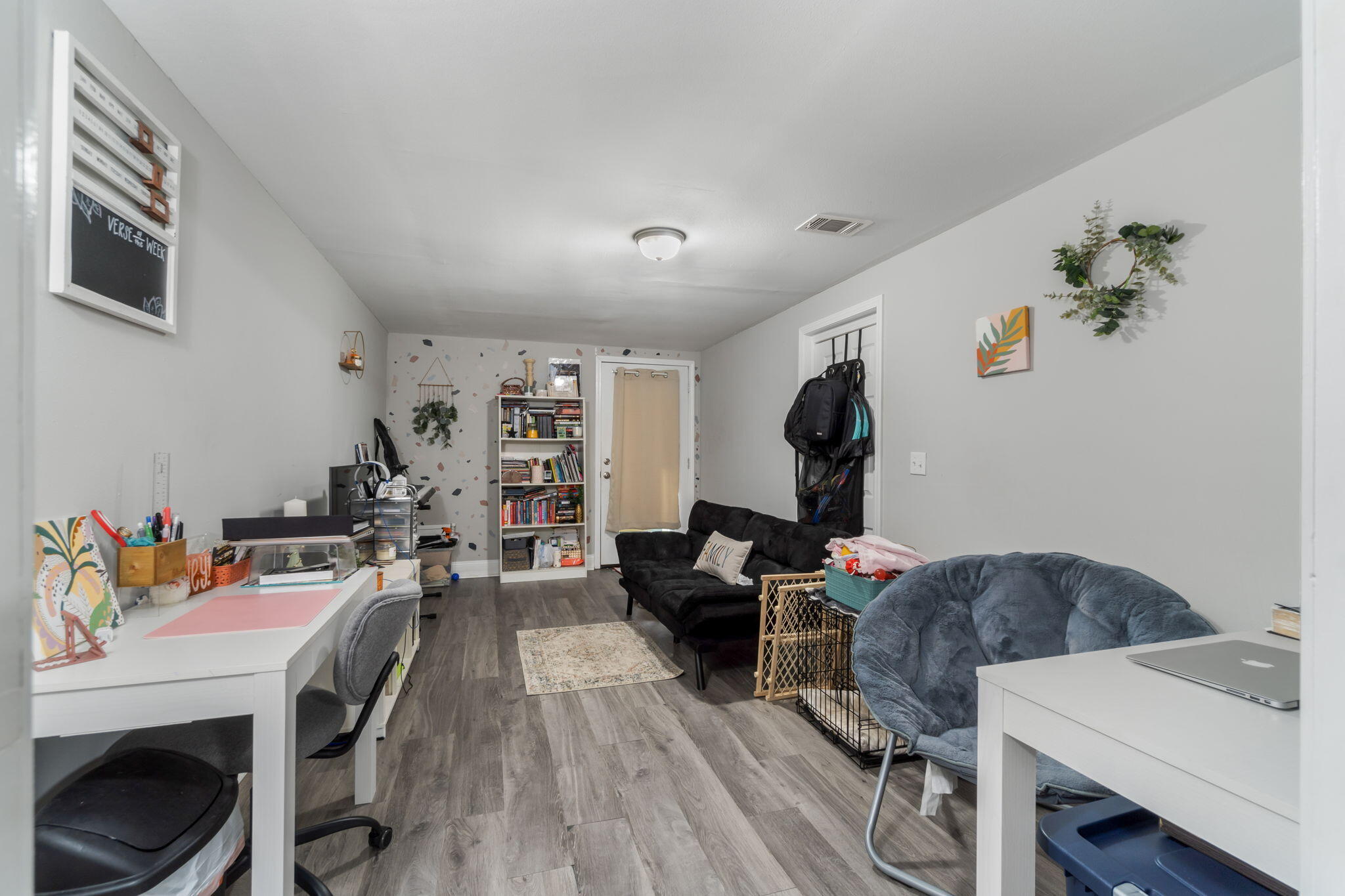 128 Sikes Drive Crestview, FL 32539 - Photo 11 of 24 a view of a workspace with furniture and wooden floor