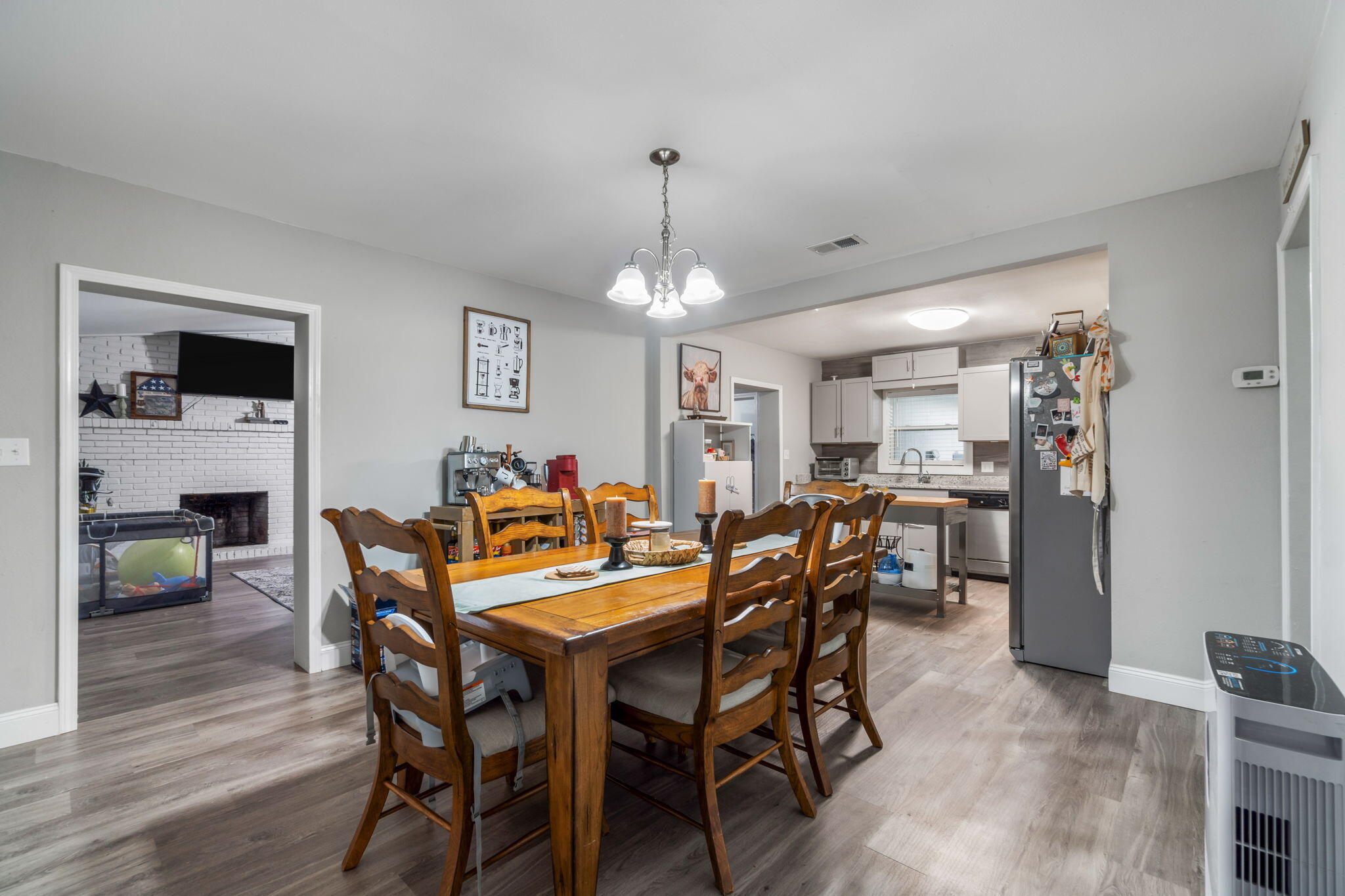 128 Sikes Drive Crestview, FL 32539 - Photo 7 of 24 a view of a dining room with furniture and wooden floor