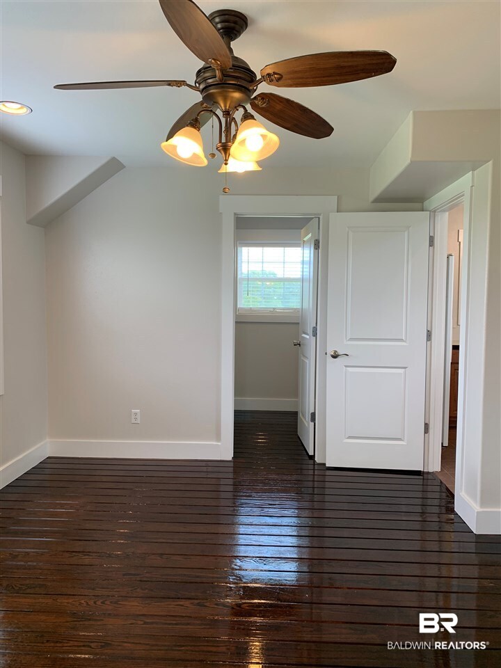 13402 County Road 91 Elberta, AL 36530 - Photo 23 of 32 Master Bedroom w/ Hardwood Floors & Walk-in Closet