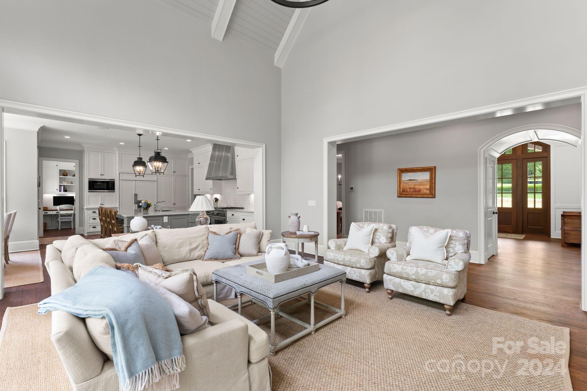 905 Martingale Lane Davidson, NC 28036 - Photo 11 of 45 a living room with furniture and wooden floor