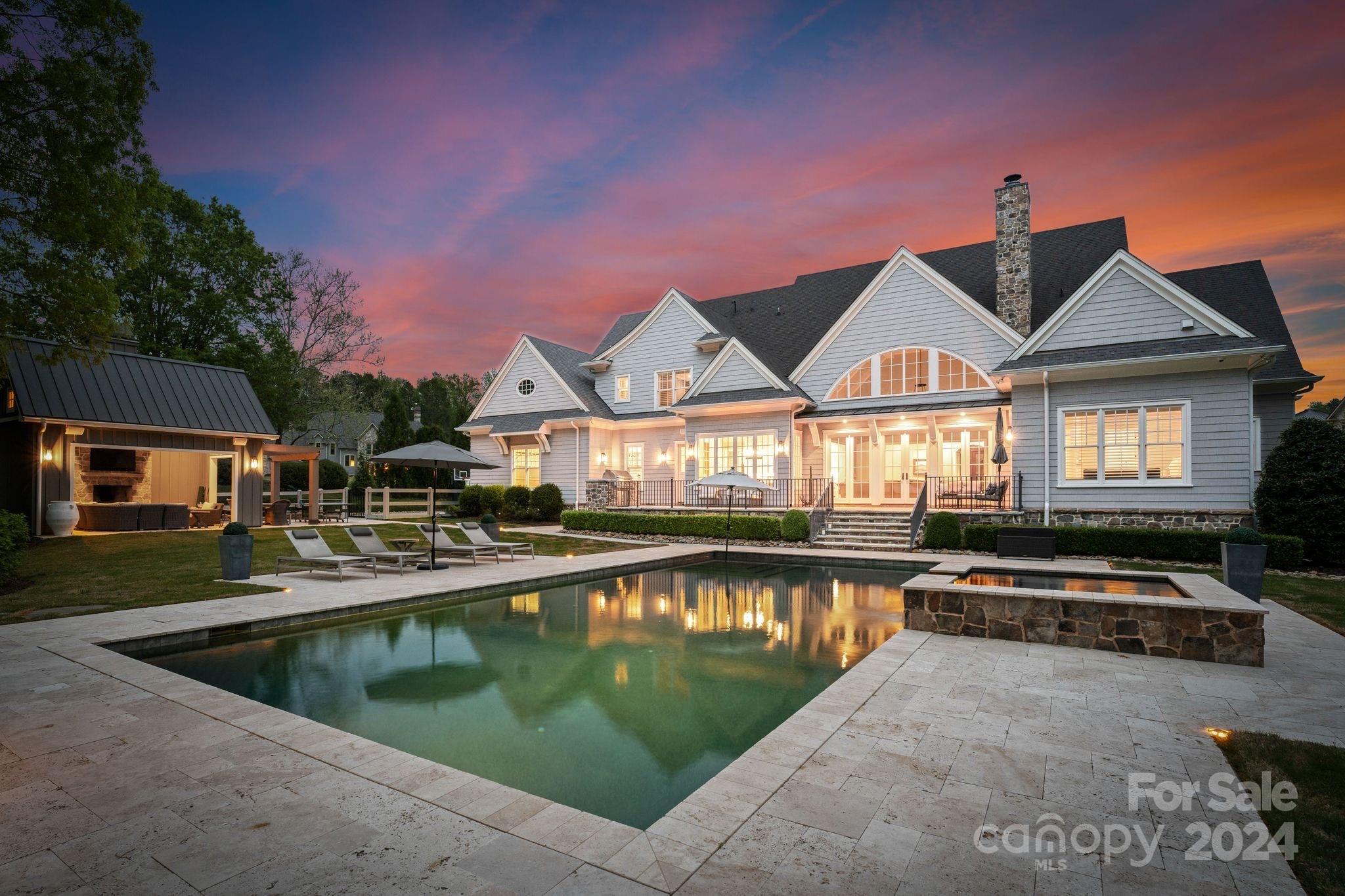 905 Martingale Lane Davidson, NC 28036 - Photo 2 of 45 a view of a house with pool and chairs
