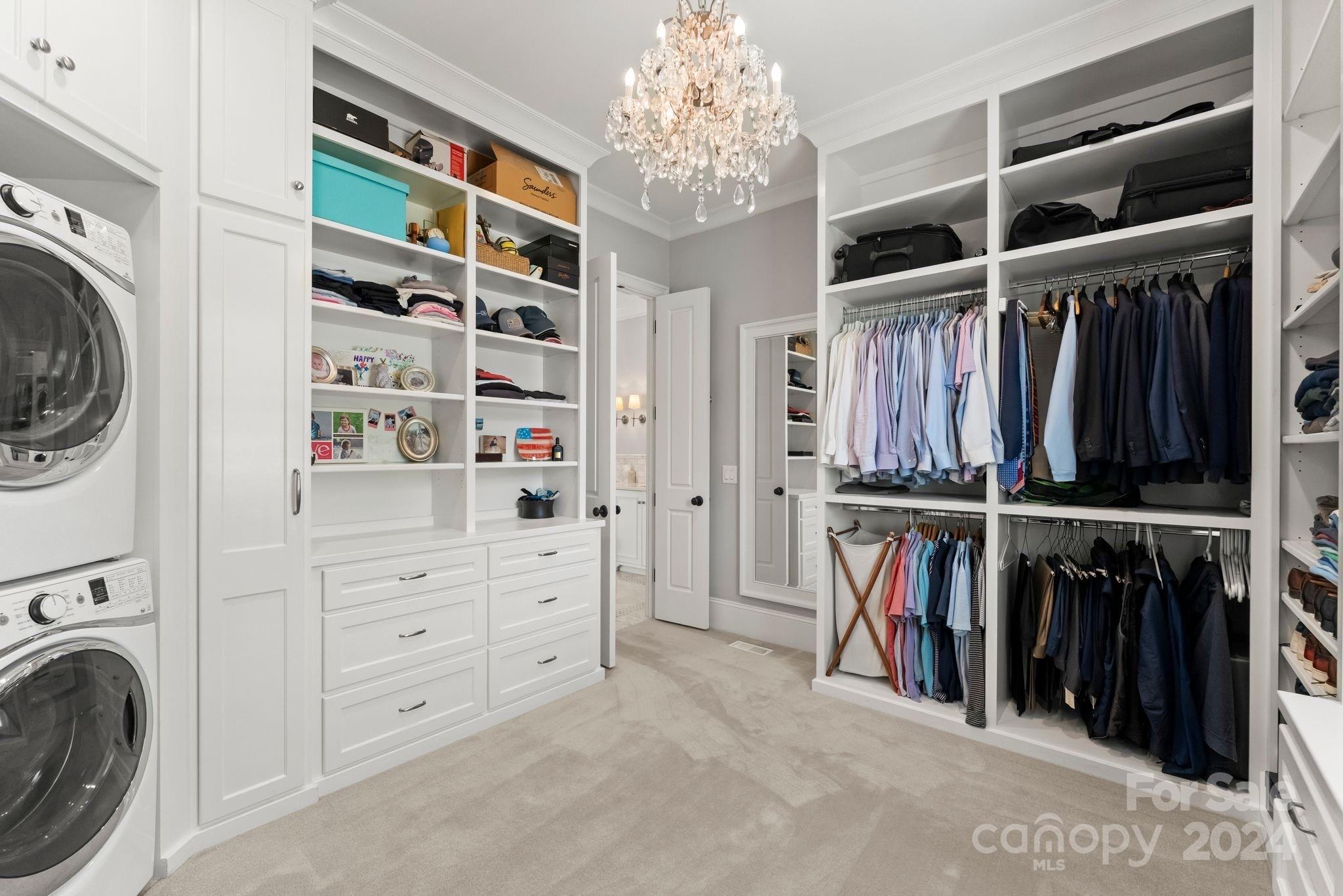 905 Martingale Lane Davidson, NC 28036 - Photo 27 of 45 a view of walk in closet with clothes and shoes