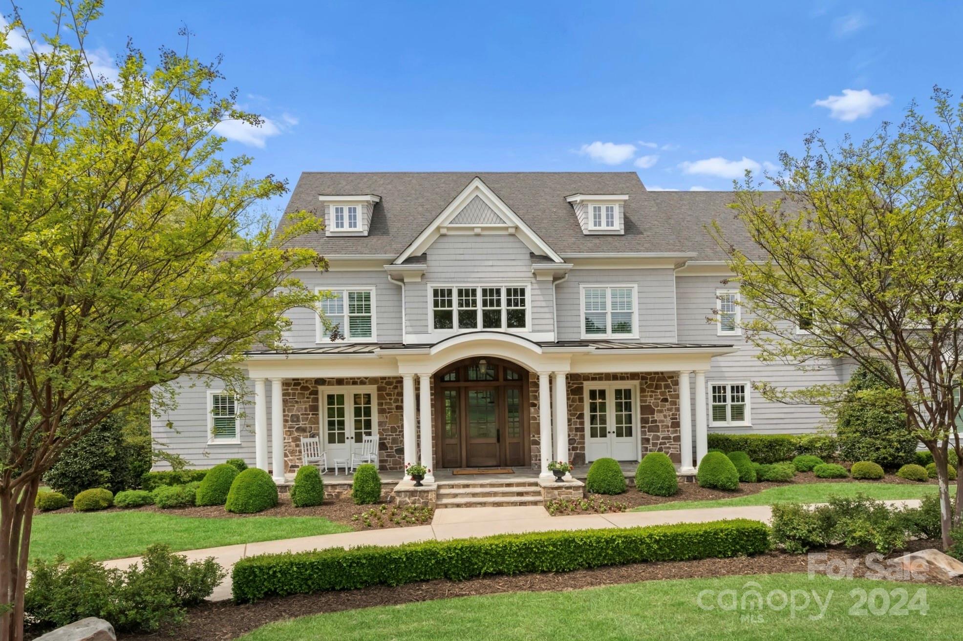 905 Martingale Lane Davidson, NC 28036 - Photo 3 of 45 a front view of a house with a yard