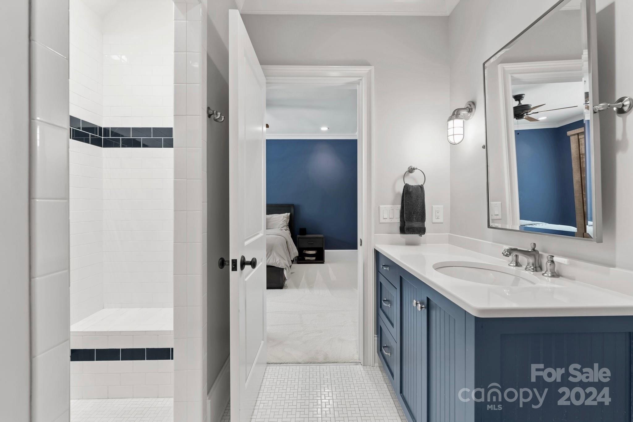 905 Martingale Lane Davidson, NC 28036 - Photo 34 of 45 a en suite bathroom with a sink and a mirror