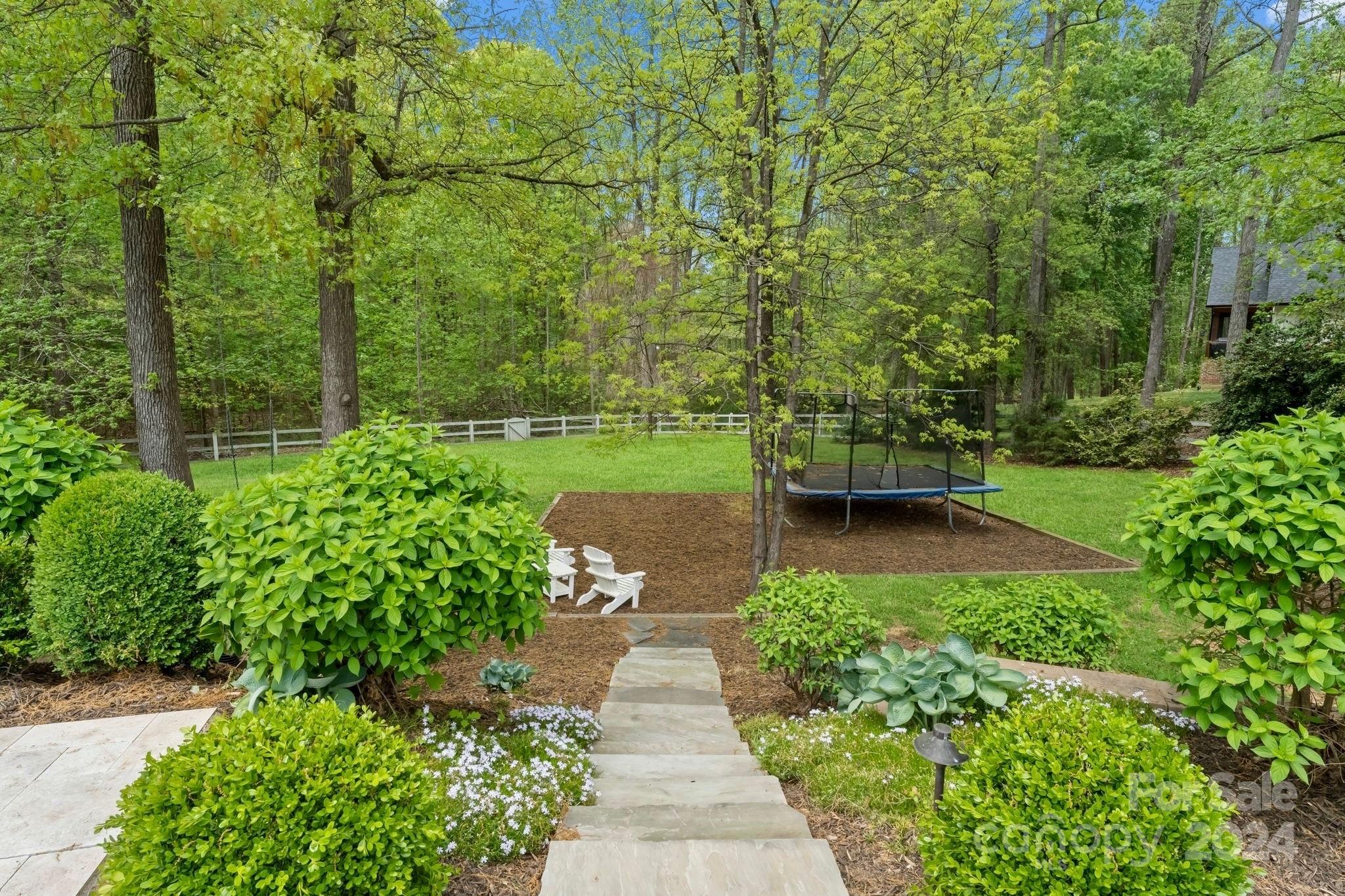 905 Martingale Lane Davidson, NC 28036 - Photo 38 of 45 a view of a garden with pathway