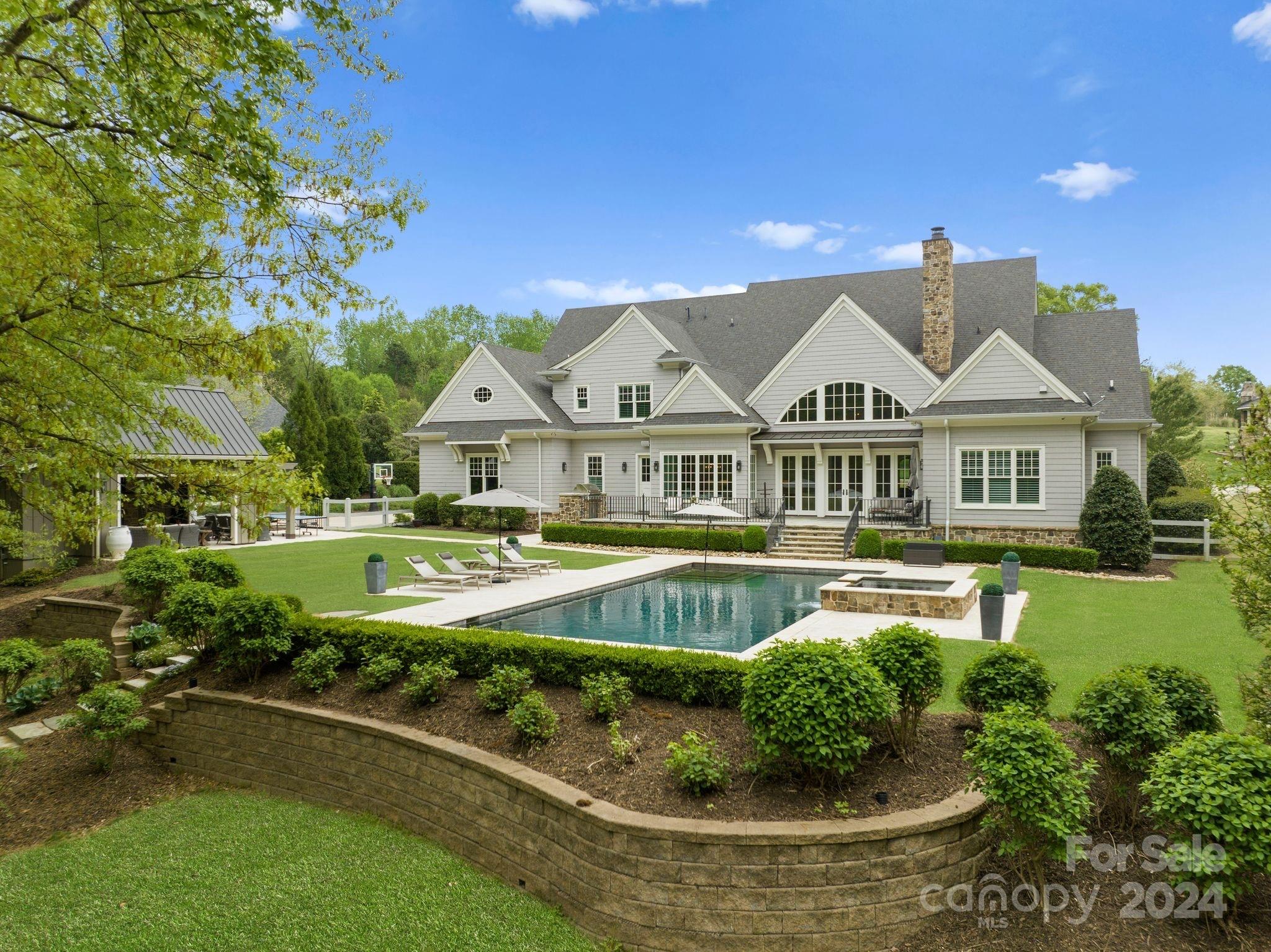 905 Martingale Lane Davidson, NC 28036 - Photo 4 of 45 a view of a house with a swimming pool