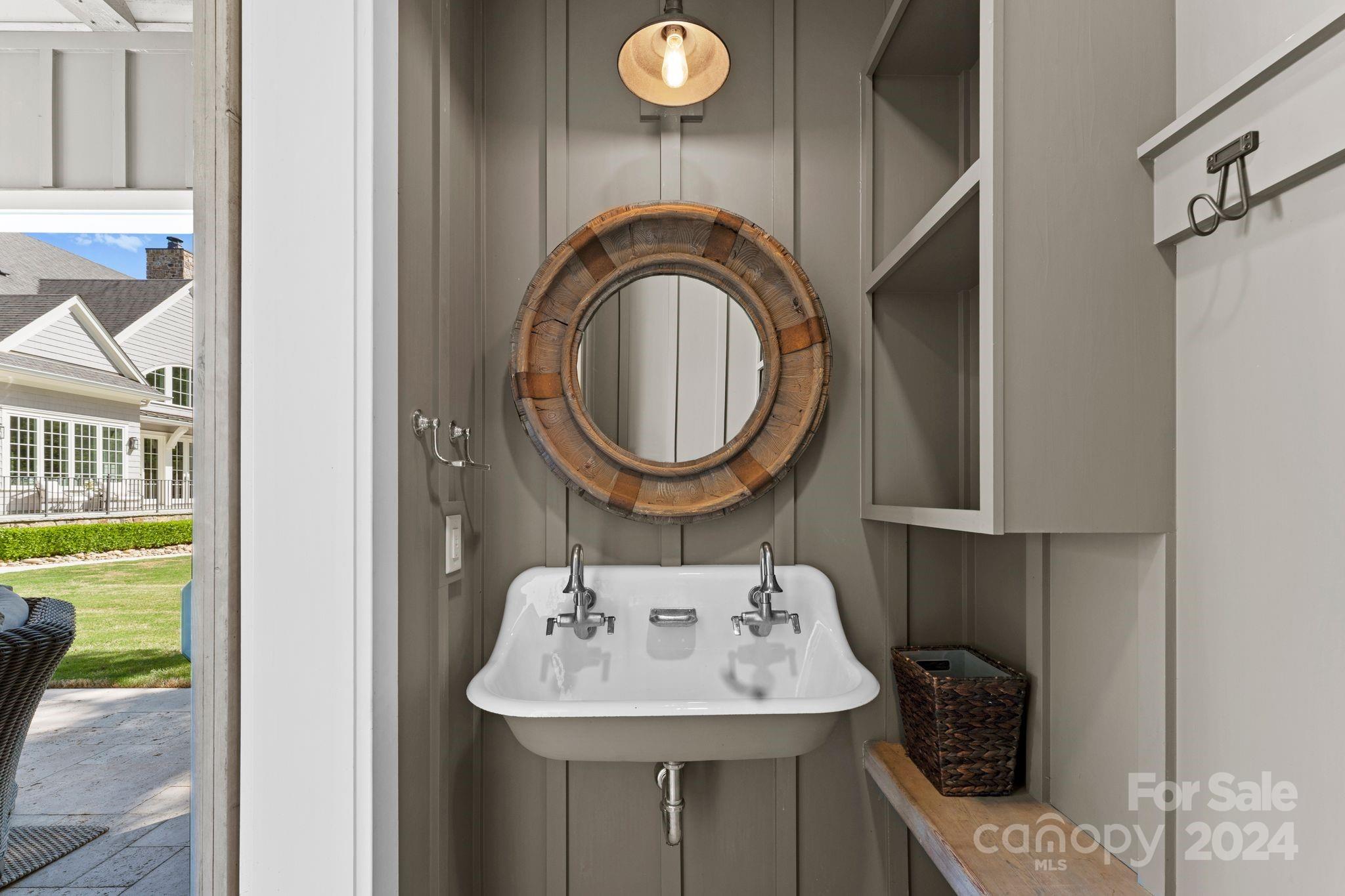 905 Martingale Lane Davidson, NC 28036 - Photo 41 of 45 a bathroom with a sink a mirror and a shower