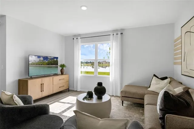 a living room with furniture and a window