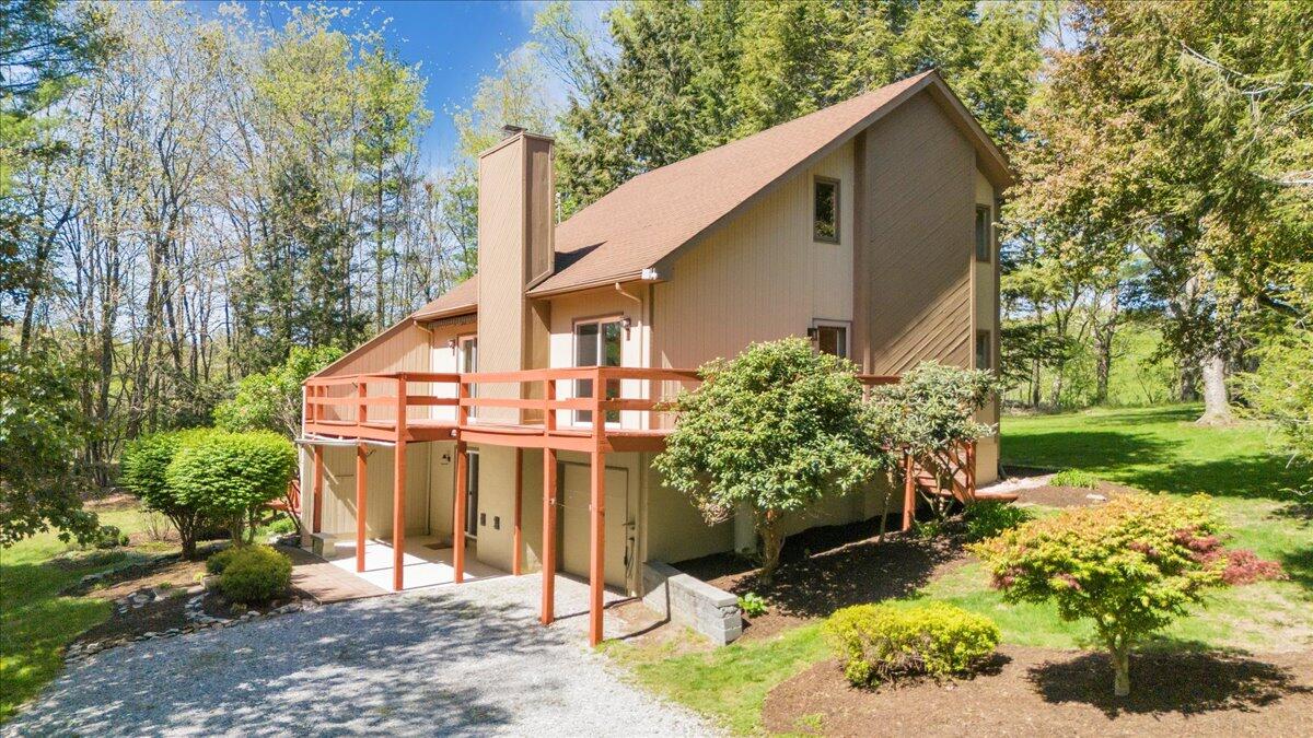 1465 Poff School Road Riner, VA 24149 - Photo 1 of 77 a front view of a house with a yard