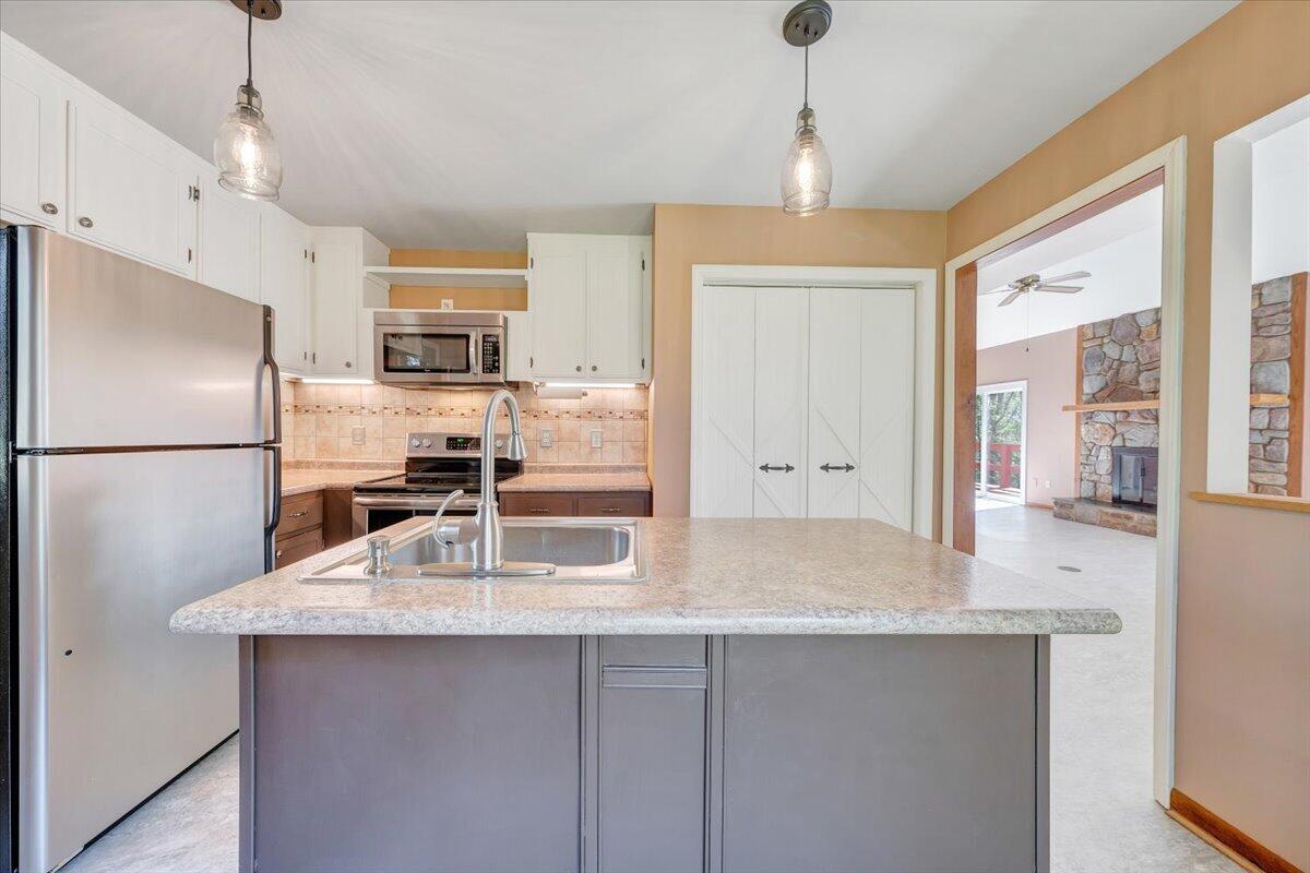 1465 Poff School Road Riner, VA 24149 - Photo 27 of 77 a kitchen with stainless steel appliances granite countertop a refrigerator a sink and a refrigerator