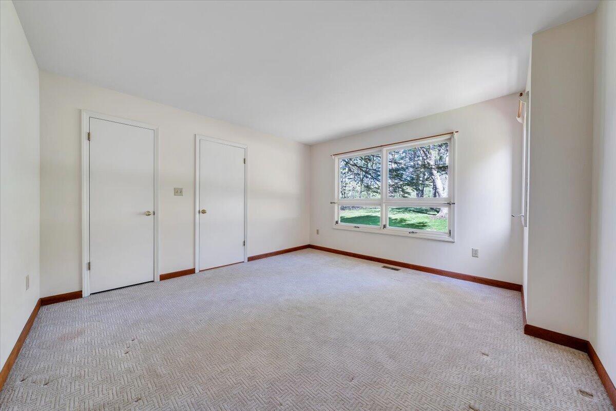 1465 Poff School Road Riner, VA 24149 - Photo 33 of 77 a view of a big room with windows and chandelier fan