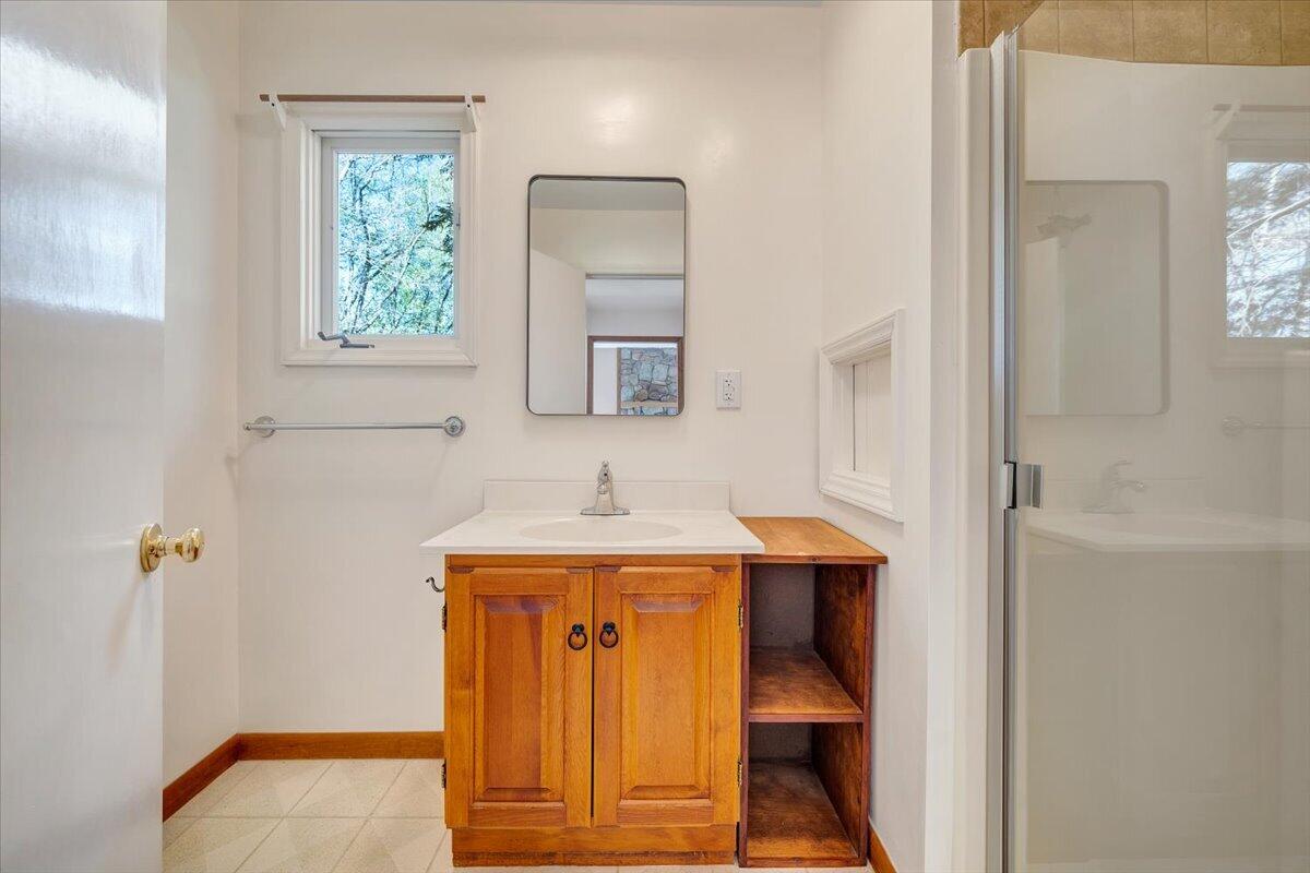 1465 Poff School Road Riner, VA 24149 - Photo 36 of 77 a bathroom with a sink and a mirror