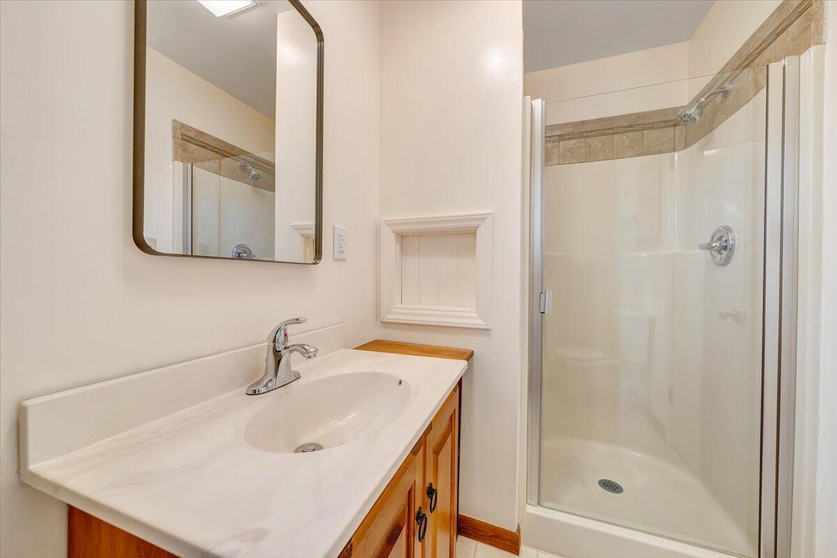 1465 Poff School Road Riner, VA 24149 - Photo 39 of 77 a bathroom with a sink and a mirror