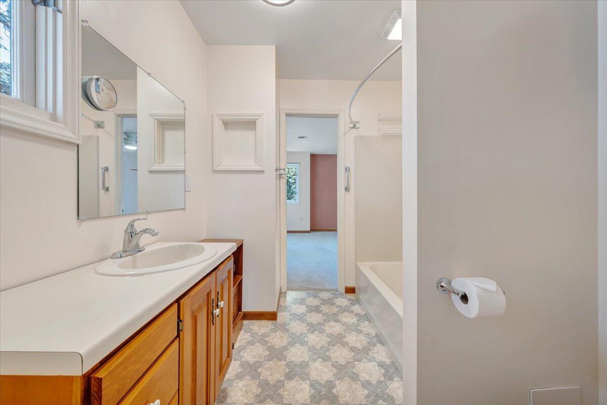 1465 Poff School Road Riner, VA 24149 - Photo 44 of 77 a bathroom with a sink and a mirror