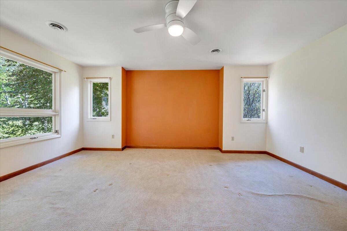 1465 Poff School Road Riner, VA 24149 - Photo 47 of 77 an empty room with windows and closet