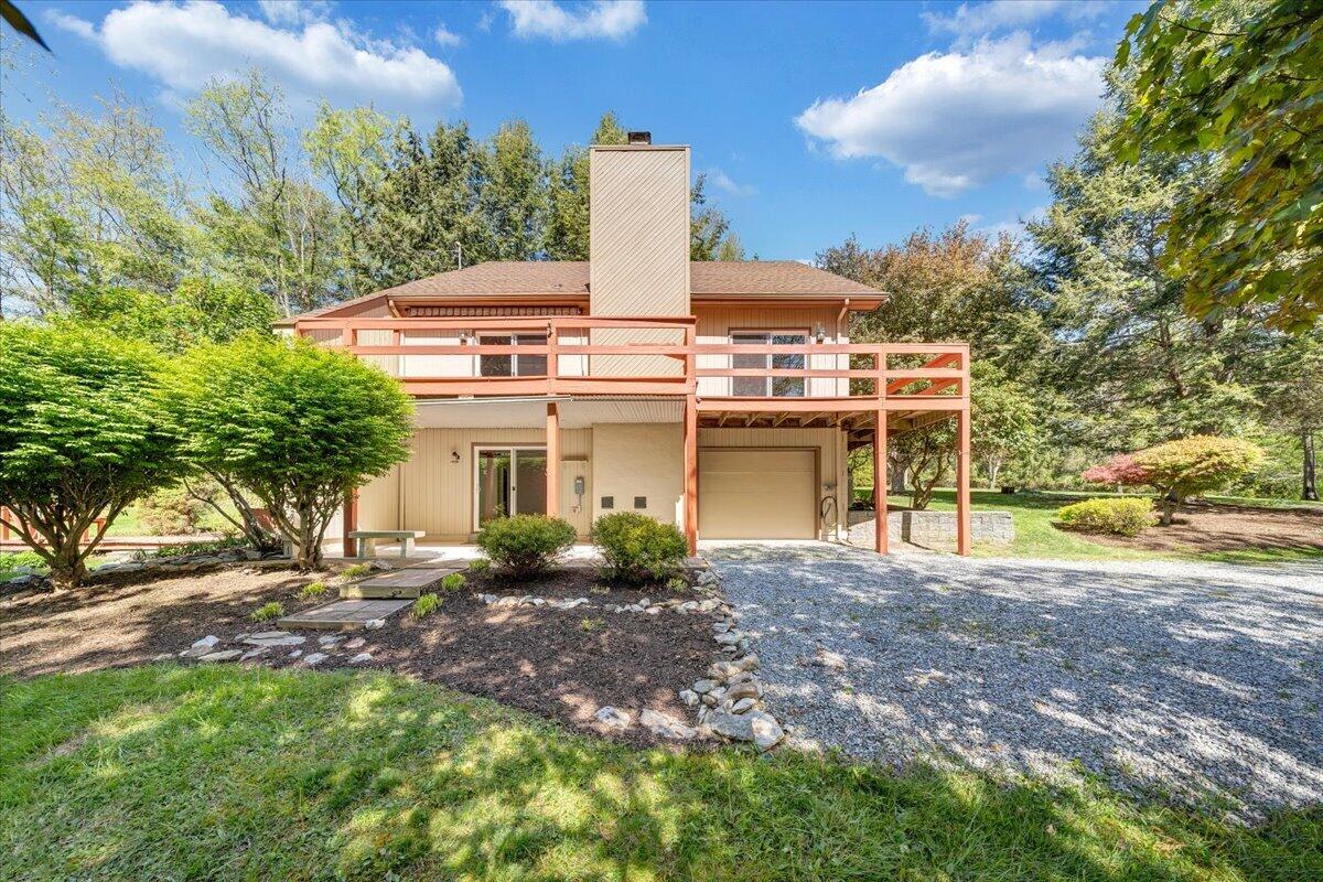 1465 Poff School Road Riner, VA 24149 - Photo 70 of 77 a view of a house with a yard and sitting area