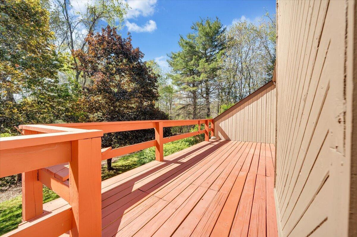 1465 Poff School Road Riner, VA 24149 - Photo 7 of 77 a view of a balcony with wooden floor and fence