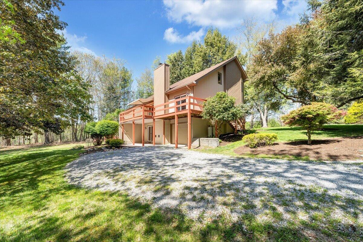 1465 Poff School Road Riner, VA 24149 - Photo 75 of 77 a view of a house with a yard and garage