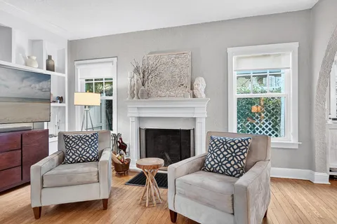 a view of a dining room with furniture and a window