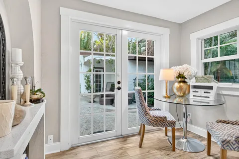 a bathroom with a sink and mirror with toilet