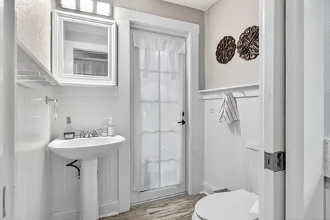 a living room with furniture and potted plant