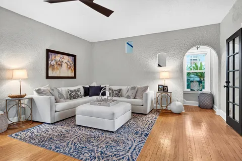 a living room with furniture and a fireplace