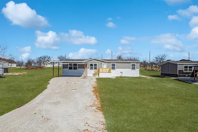 a view of a house with a big yard