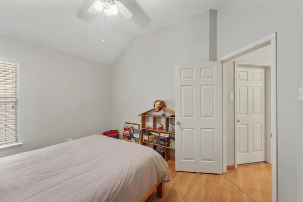 a bed room with a bed and a chandelier