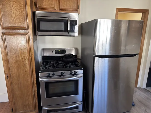 a stove top oven and refrigerator