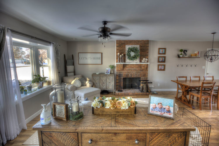 5467 South Mill Pond Road Rochelle, IL 61068 - Photo 6 of 18 a living room with fireplace furniture and a large window