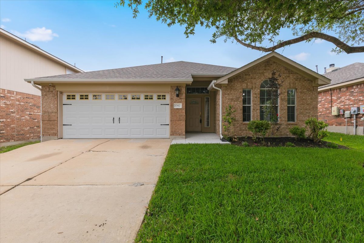 17812 Masi Loop Pflugerville, TX 78660 - Photo 2 of 38 Brick exterior with a gabled architectural feature