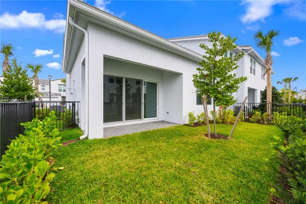 a view of an house with backyard space and garden