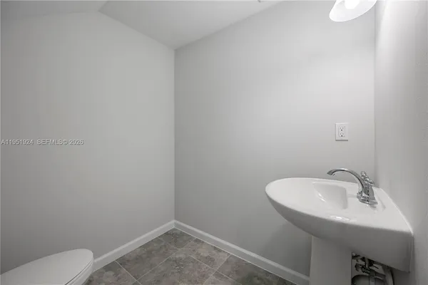 a bathroom with a sink and toilet