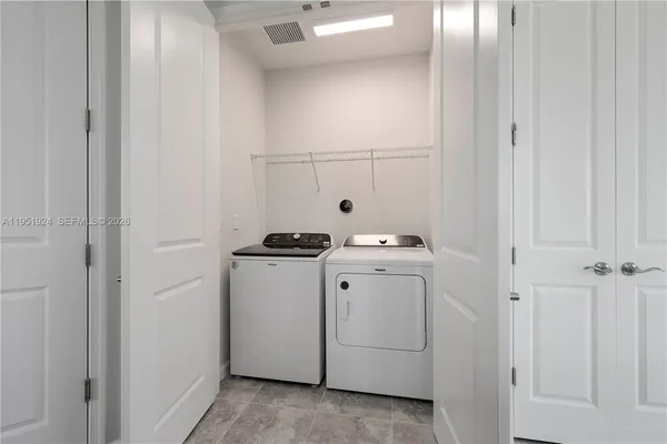 a utility room with dryer and washer