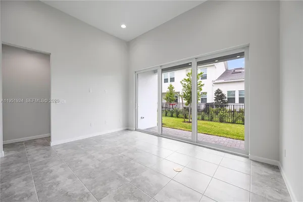 a view of an empty room with glass windows
