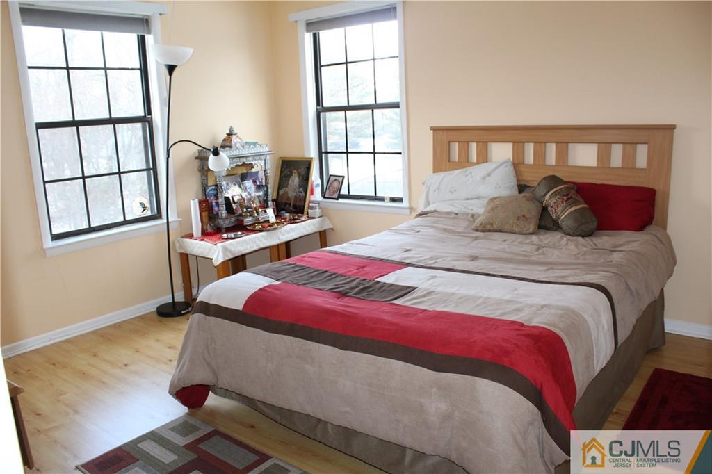 4901 Stonehedge Road, Unit 4901 Edison, NJ 08820 - Photo 17 of 22 a bedroom with a bed and a window